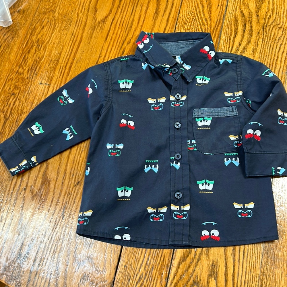 Little Rebels long sleeve infant shirt.  Monster print navy background. Size 18M